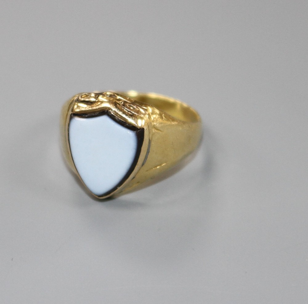 A Victorian yellow metal (probably 18ct) and shield shaped sardonyx poison ring, size L/M, gross weight 5.2 grams.